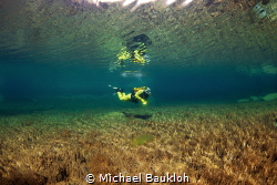 Floating in crystal water by Michael Baukloh 